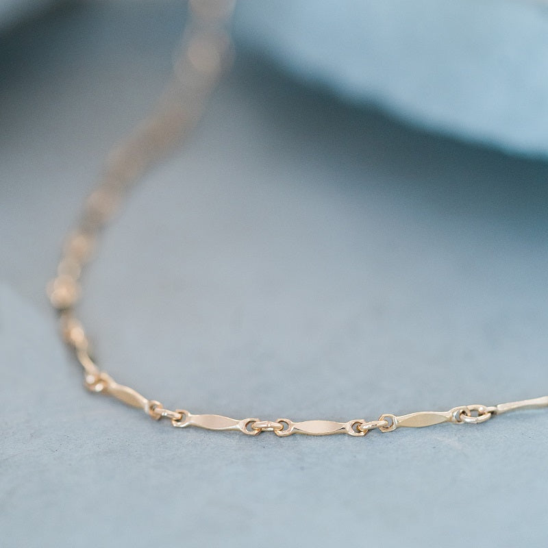This gold choker is dashing and perfect for layering.