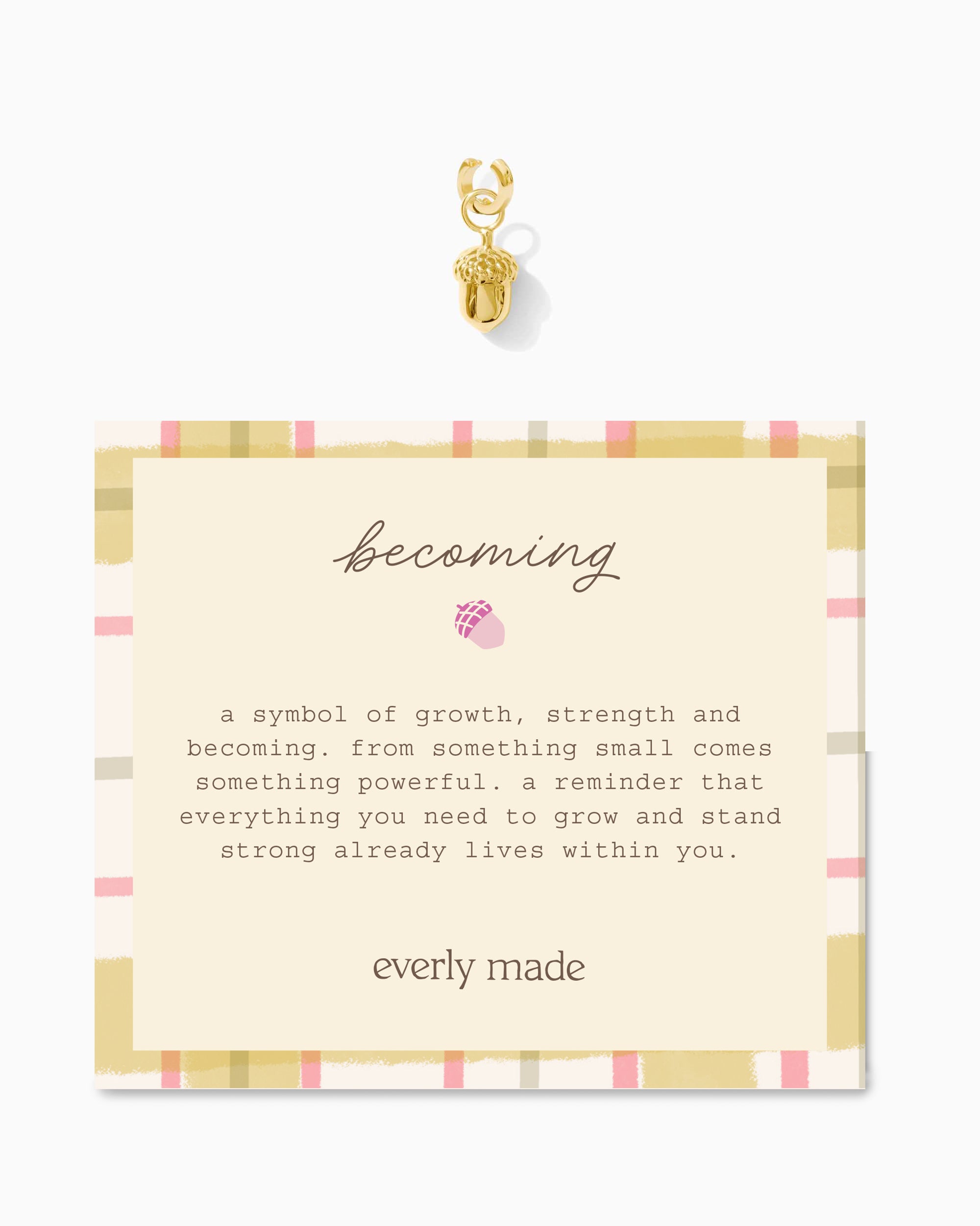Jewelry card with the title "becoming" with gold charm and text  on a white background with "everly made" at the bottom