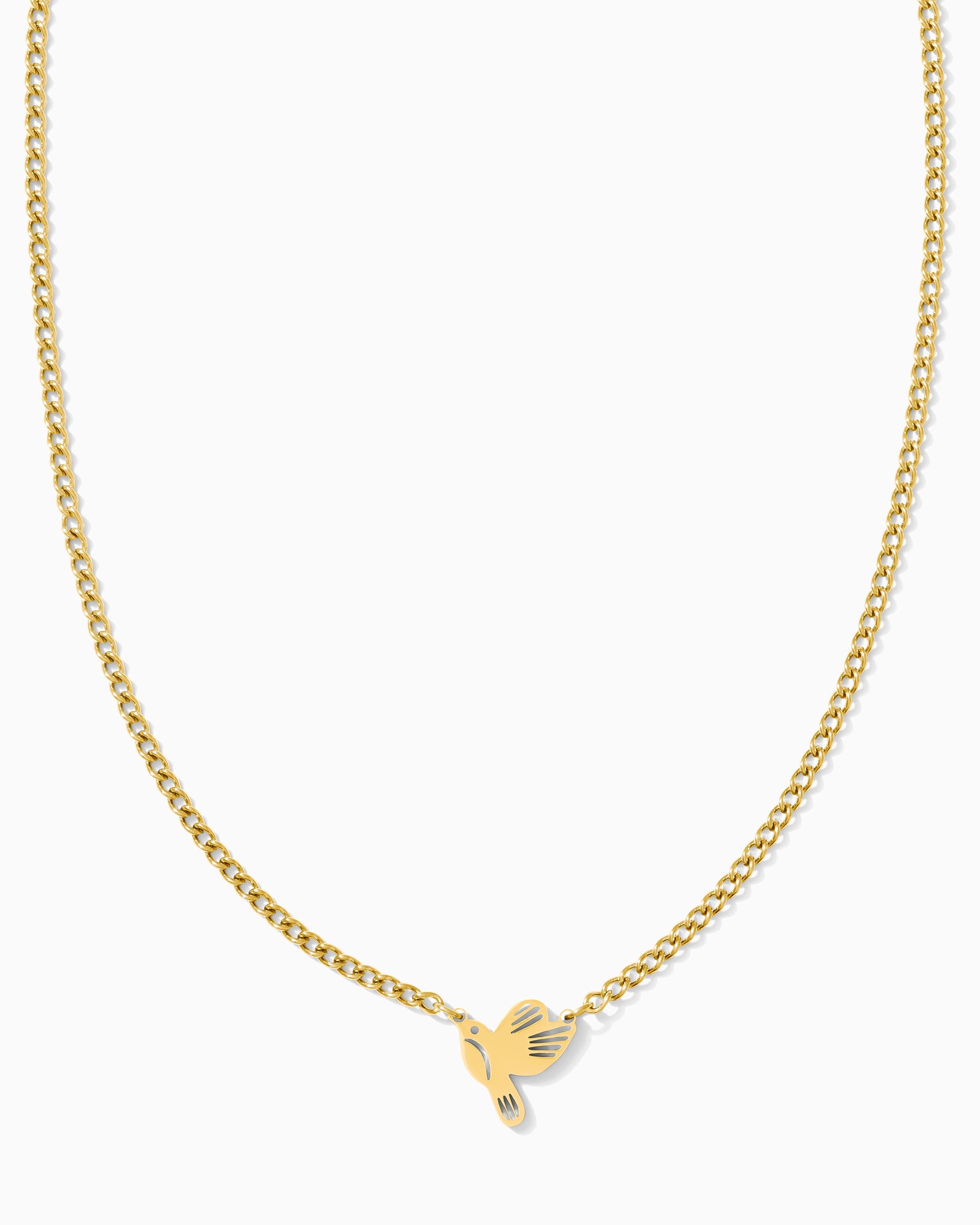 Gold necklace with a bird  pendant on a white background.